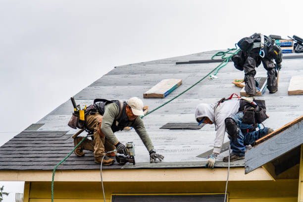 Professional Gutter Installation technician working in Howell, MI